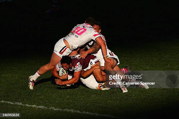 Brent Kite of the Sea Eagles is tackled during the round 16 NRL match between the Sydney Roosters and the Manly Sea Eagles at Allianz Stadium on June...
