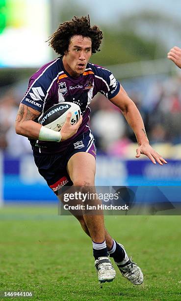 Kevin Proctor of the Storm runs the ball during the round 16 NRL match between the Canterbury Bulldogs and the Melbourne Storm at Virgin Australia...