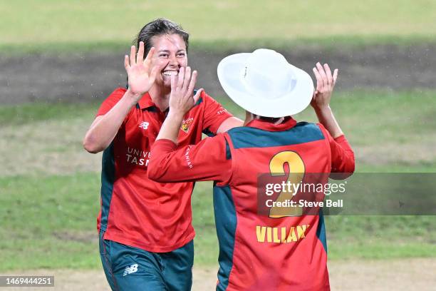 Molly Strano and Elyse Villani of the Tigers celebrates the wicket of Madeline Penna of the Scorpions during the WNCL Final match between Tasmania...