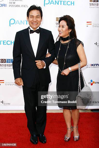 Actor Ahn Sung-Ki and wife attend the Look East Korean Film Festival - Opening Ceremony held at the Grauman's Chinese Theatre on June 23, 2012 in...