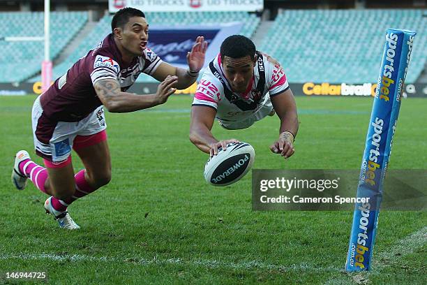 Tautau Moga of the Roosters scores a try during the round 16 NRL match between the Sydney Roosters and the Manly Sea Eagles at Allianz Stadium on...
