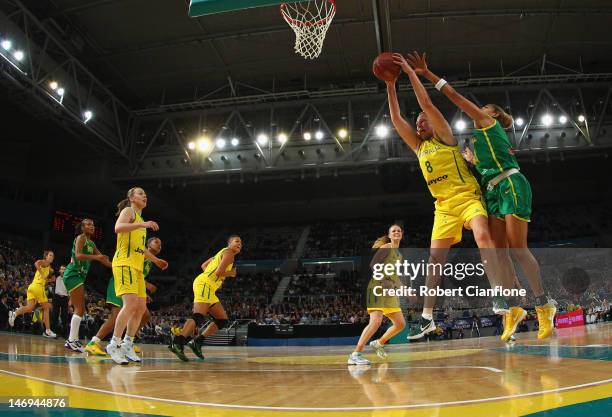 Suzy Batkovic of Australia gets to the ball ahead of her opponent during the first match between the Australian Opals and Brazil at Hisense Arena on...