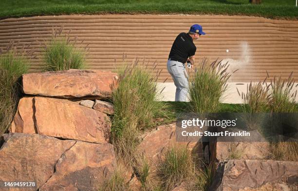 Mikko Korhonen of Finland plays his bunker shot on the 16th hole during Day Three of the Hero Indian Open at Dlf Golf and Country Club on February...