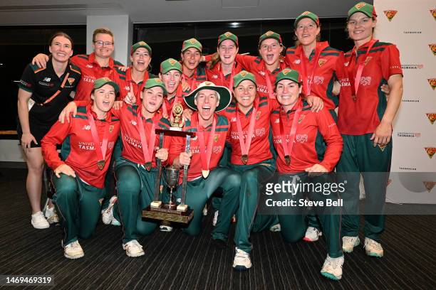 Tasmanian Tigers players celebrate the win with the trophy during the WNCL Final match between Tasmania and South Australia at Blundstone Arena, on...
