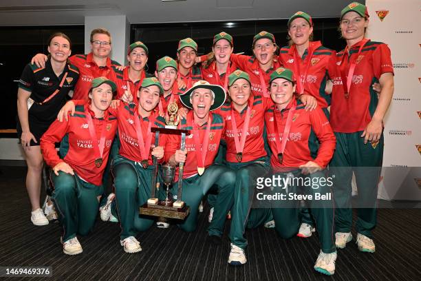 Tasmanian Tigers players celebrate the win with the trophy during the WNCL Final match between Tasmania and South Australia at Blundstone Arena, on...