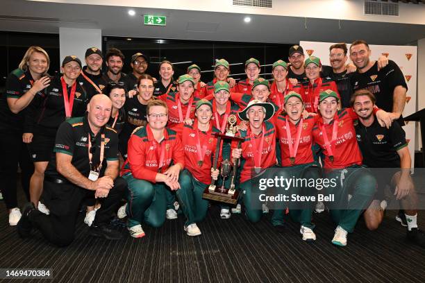 Tasmanian Tigers players celebrate the win with the trophy during the WNCL Final match between Tasmania and South Australia at Blundstone Arena, on...