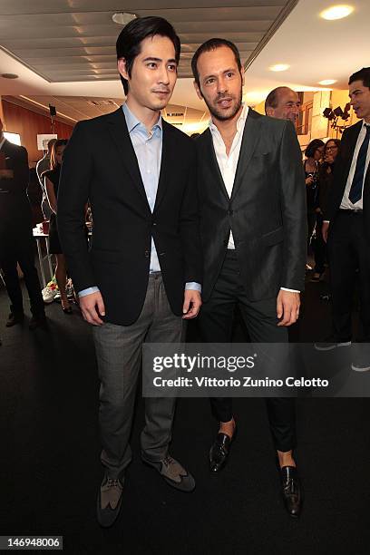 Vic Chou and designer Massimiliano Giornetti pose backstage during the Salvatore Ferragamo show as part of Milan Fashion Week Menswear Spring/Summer...