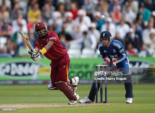 Dwayne Bravo of the West Indies hits out watched by England wicketkeeper Craig Kieswetter during the NatWest International T20 match between England...