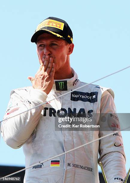 Michael Schumacher of Germany and Mercedes GP celebrates on the podium after finishing third during the European Grand Prix at the Valencia Street...