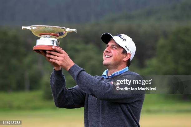 Sam Walker of England posses with the trophy after winning, the play off during the 2012 Scottish Hydro Challenge - Day Four at The Macdonald Spey...