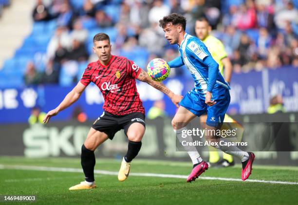 Javi Puado of RCD Espanyol controls the ball whilst under pressure from Matija Nastasic of RCD Mallorca during the LaLiga Santander match between RCD...