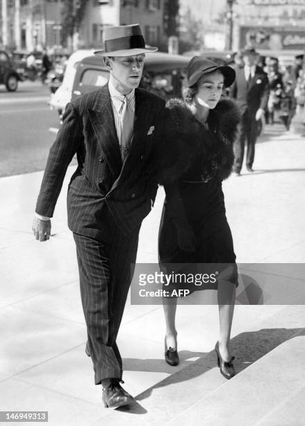 American actor, singer and dancer Fred Astaire and his wife Phyllis Livingston Potter go to funeral services for Irving Thalberg, husband of Norma...
