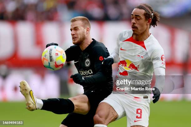 Hrvoje Smolcic of Eintracht Frankfurt and Yussuf Poulsen of RB Leipzig battle for the ball during the Bundesliga match between RB Leipzig and...