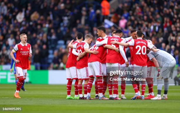 Oleksandr Zinchenko of Arsenal, wearing Captains Armband in the colour of Ukraine, walks over as players of Arsenal huddle prior to the Premier...