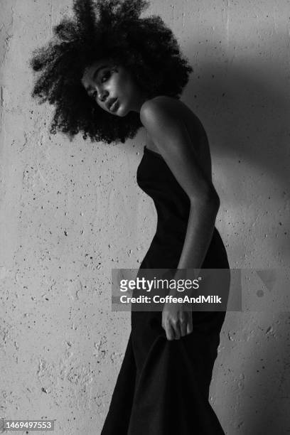 black and white photo of beautiful afro woman with perfect make-up wearing amazing dress - fashion dress stock pictures, royalty-free photos & images