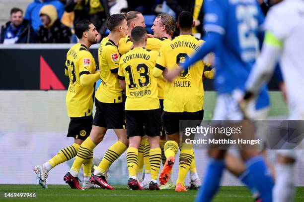 Julian Brandt of Borussia Dortmund celebrates after scoring the team's first goal with teammates during the Bundesliga match between TSG Hoffenheim...