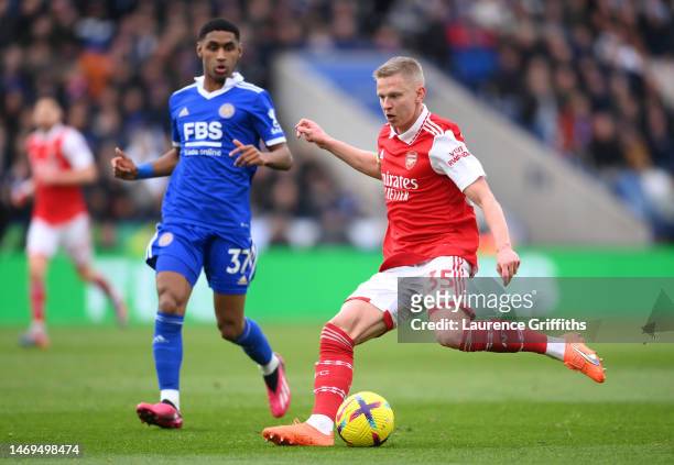 Oleksandr Zinchenko of Arsenal controls the ball whilst under pressure from Tete of Leicester City during the Premier League match between Leicester...