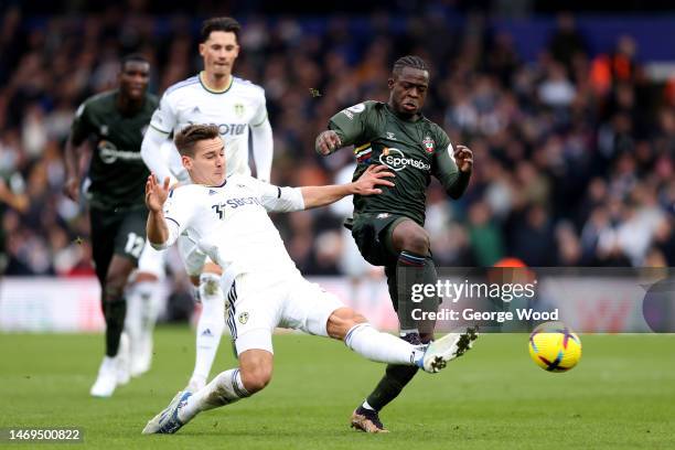 Kamaldeen Sulemana of Southampton is challenged by Maximilian Woeber of Leeds United during the Premier League match between Leeds United and...