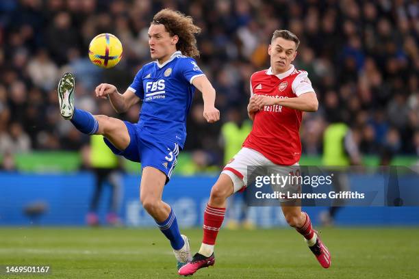 Wout Faes of Leicester City clears the ball from Leandro Trossard of Arsenal during the Premier League match between Leicester City and Arsenal FC at...
