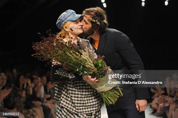 LMILAN, ITALY Designers Vivienne Westwood and husband Andreas Kronthaler acknowledge the applause of the audience after the Vivienne Westwood show as...