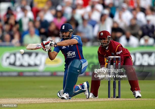 Ravi Bopara of England hits out watched by the West Indies wicketkeeper Denesh Ramdin during the NatWest International T20 match between England and...