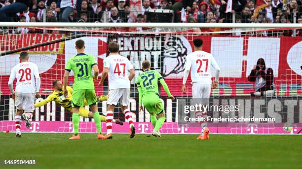 Maximilian Arnold of VfL Wolfsburg scores their sides second goal from the penalty spot during the Bundesliga match between 1. FC Koeln and VfL...