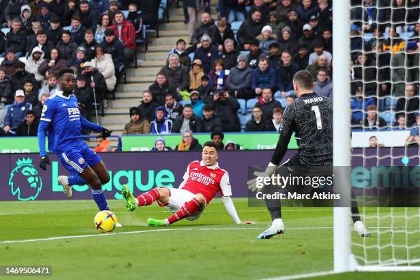 Gabriel Martinelli of Arsenal scores their sides first goal during the Premier League match between Leicester City and Arsenal FC at The King Power...