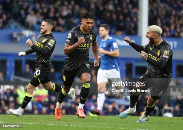 Ollie Watkins of Aston Villa celebrates after scoring the team's first goal from a penalty kick during the Premier League match between Everton FC...