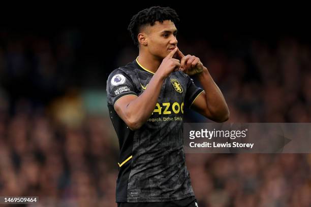 Ollie Watkins of Aston Villa celebrates after scoring the team's first goal from a penalty kick during the Premier League match between Everton FC...