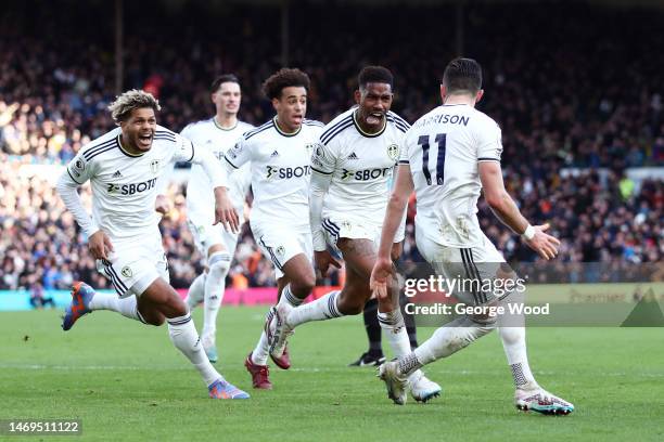 Junior Firpo of Leeds United celebrates with team mates after scoring their sides first goal during the Premier League match between Leeds United and...