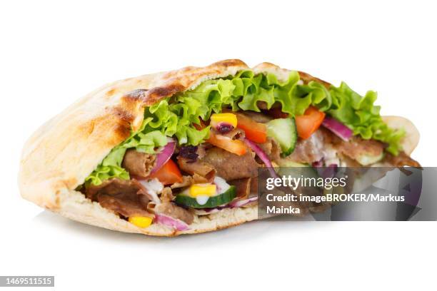 doener kebab doner kebap fast food in a flatbread cut out against a white background in stuttgart, germany - doner kebab stock pictures, royalty-free photos & images