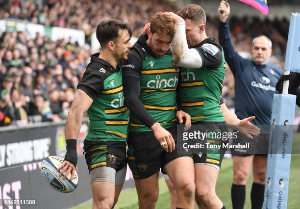 James Ramm of Northampton Saints is congratulated by Tom Collins and Fraser Dingwall of Northampton Saints during the Gallagher Premiership Rugby...