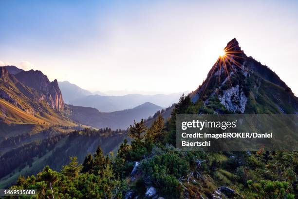 sun star on choepfenberg, mountain landscape at sunset, view of glarnerland and central switzerland, cantons of glarus and schwyz, switzerland - schwyz stock pictures, royalty-free photos & images