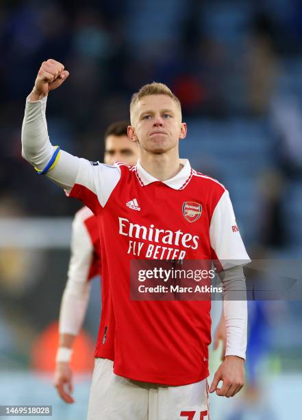 Oleksandr Zinchenko of Arsenal celebrates victory while wearing the captains armband to indicate peace and sympathy with Ukraine one year on after...