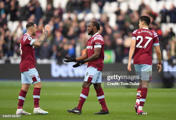 Danny Ings and Michail Antonio of West Ham United celebrate victory after the Premier League match between West Ham United and Nottingham Forest at...