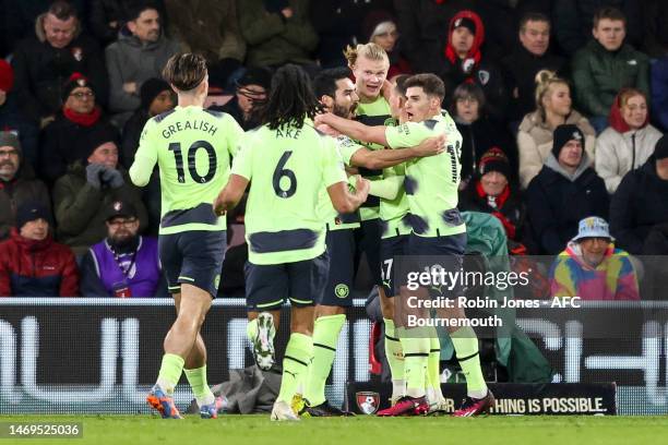 Erling Håland of Manchester City is congratulated by team-mates after he scores a goal to make it 2-0 during the Premier League match between AFC...