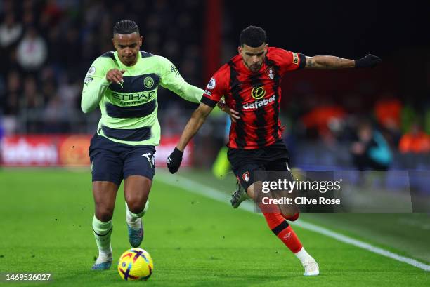 Manuel Akanji of Manchester City battles for possession with Dominic Solanke of AFC Bournemouth during the Premier League match between AFC...