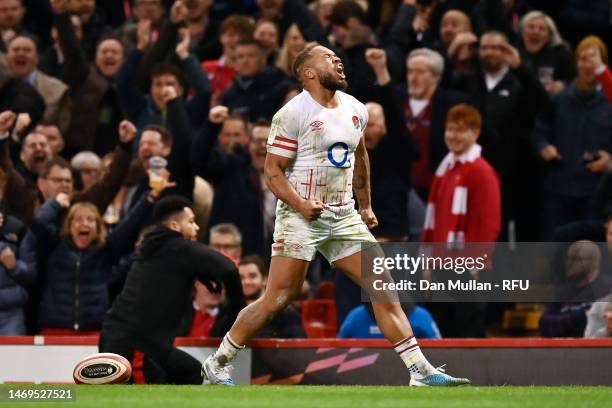 Ollie Lawrence of England celebrates scoring their side's third try during the Six Nations Rugby match between Wales and England at Principality...