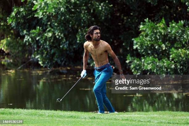 Akshay Bhatia of the united States watches after hitting his second shot on the 6th hole from the water during the third round of The Honda Classic...