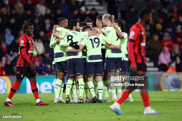 Julian Alvarez of Manchester City celebrates with team mates after his shot on goal, which deflects off Chris Mepham of AFC Bournemouth leads to an...