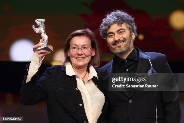 Helene Louvart and Giacomo Abbruzzese are seen on stage after winning the Silver Bear for an Outstanding Artistic Contribution for the cinematography...