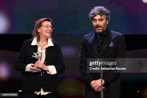 Helene Louvart and Giacomo Abbruzzese are seen on stage after winning the Silver Bear for an Outstanding Artistic Contribution for the cinematography...