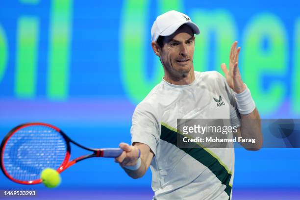 Andy Murray of Great Britain returns the ball to Daniil Medvedev of Russia during their final match in day six of Qatar ExxonMobil Open at Khalifa...