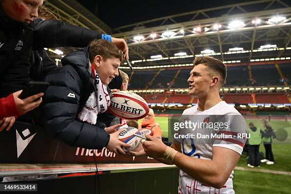 Slade England Henry Slade of England signs memorabilia for a fan after the Six ...