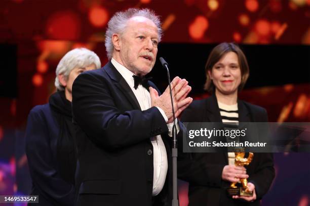 Nicolas Philibert speaks on stage after winning the Golden Bear for Best Film Award for "Sur l’Adamant" at the award ceremony of the 73rd Berlinale...