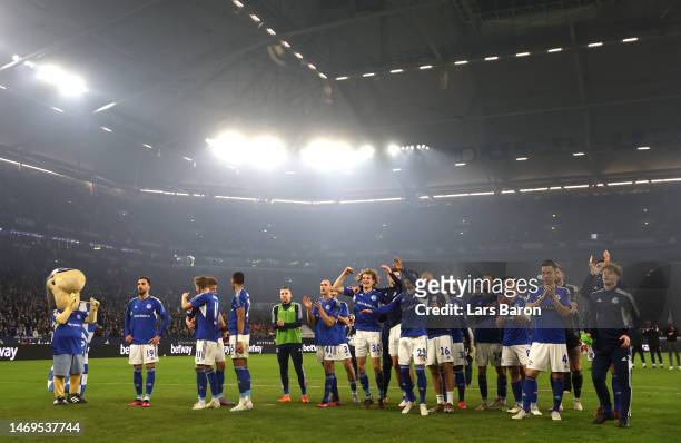 General view as players of FC Schalke 04 celebrate in front of their fans after the Bundesliga match between FC Schalke 04 and VfB Stuttgart at...