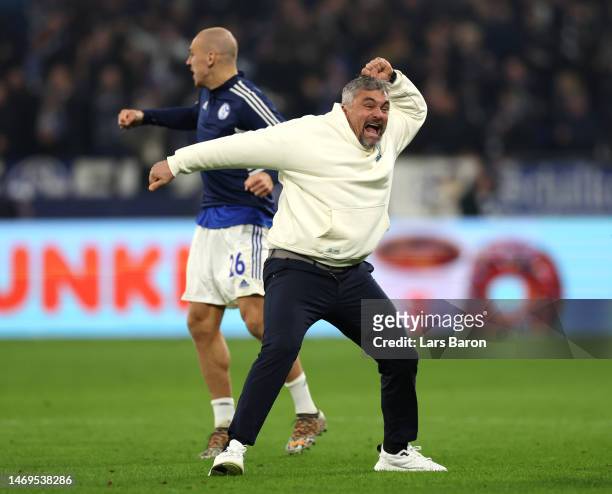 Thomas Reis, Head Coach of FC Schalke 04, celebrates with Michael Frey during the Bundesliga match between FC Schalke 04 and VfB Stuttgart at...
