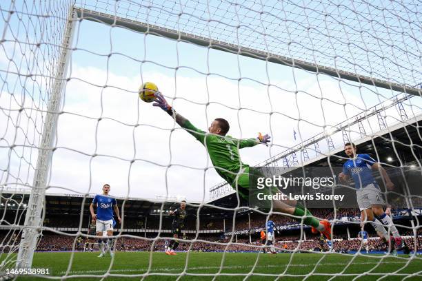 Jordan Pickford of Everton makes a save from a shot by Ollie Watkins of Aston Villa during the Premier League match between Everton FC and Aston...