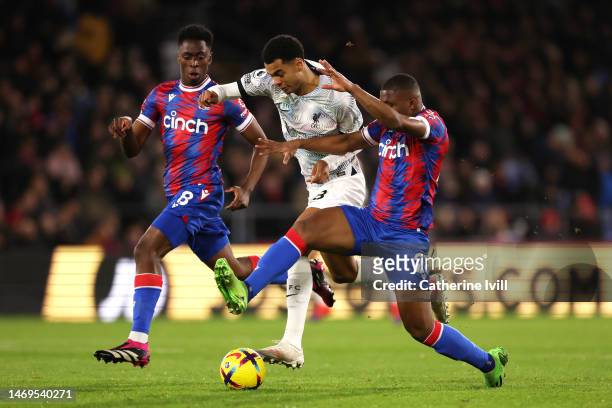 Naby Keita of Liverpool is challenged by Cheick Doucoure of Crystal Palace during the Premier League match between Crystal Palace and Liverpool FC at...