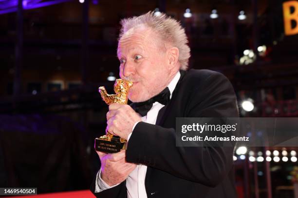Nicolas Philibert kisses the Golden Bear for Best Film won for his Film "Sur l’Adamant" on the red carpet after the award ceremony of the 73rd...